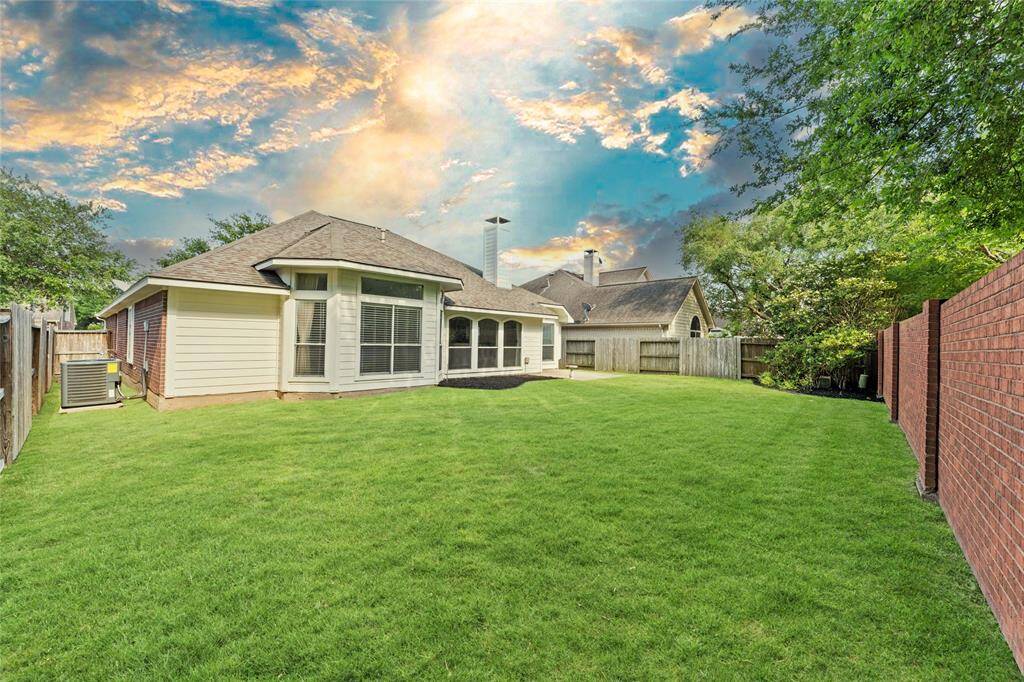The brick sections of the fence add a touch of charm and durability, creating a sense of security.