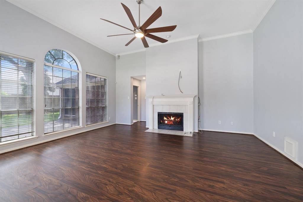 Main living space is just off the kitchen. The large family room has more high ceilings with crown molding and nice views of the backyard.