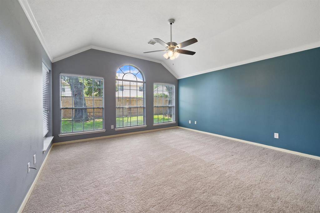 Past the family room in the back of the home is the private Primary Bedroom.