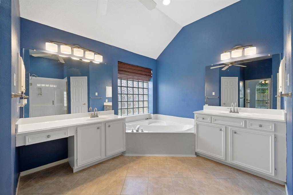 Primary bathroom is large and spacious with two separate vanities, jetted tub and separate shower.