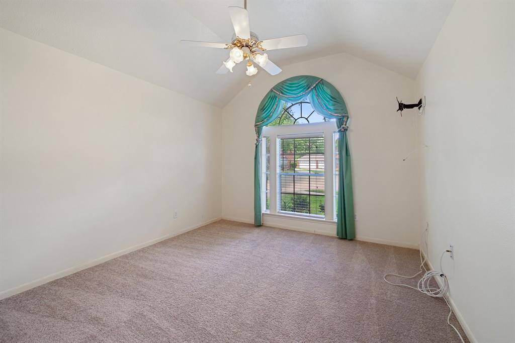 Secondary bedroom #2 off the front of the home also has high ceilings.