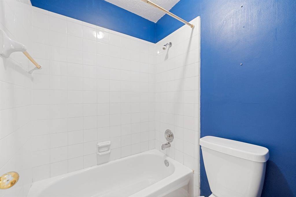 Full bathroom with tub/shower combo.