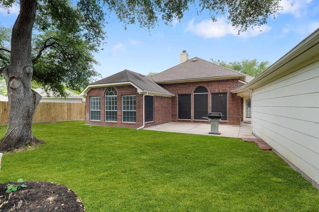 Backyard has plenty of room for your grilling, outdoor lounging and entertainment.