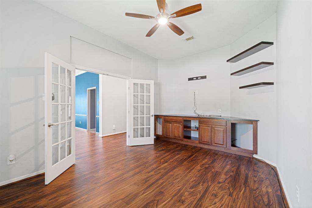 Another large room used for an office space can be closed off for privacy from the rest of the home.