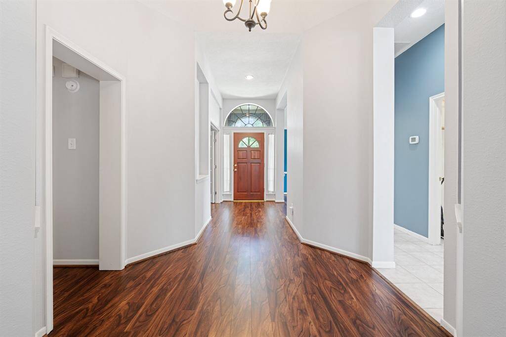 Front entry hallway has some unique art niches to display your paintings and/or sculptures.  The luxury vinyl plank runs throughout most of the house.