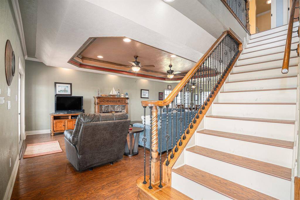 Detailed staircase with intricate wood and iron spindles.