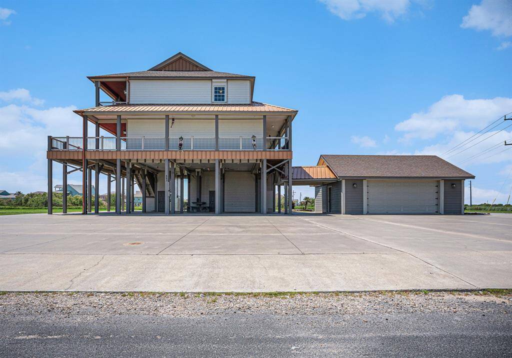 This oversized 2-car garage offers ample space and the added convenience of drive-through access.