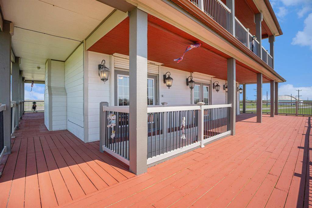 Step out onto the expansive wrap-around deck, an ideal space for outdoor enjoyment. For added peace of mind and convenience, all windows are equipped with automatic hurricane roll-down shutters.