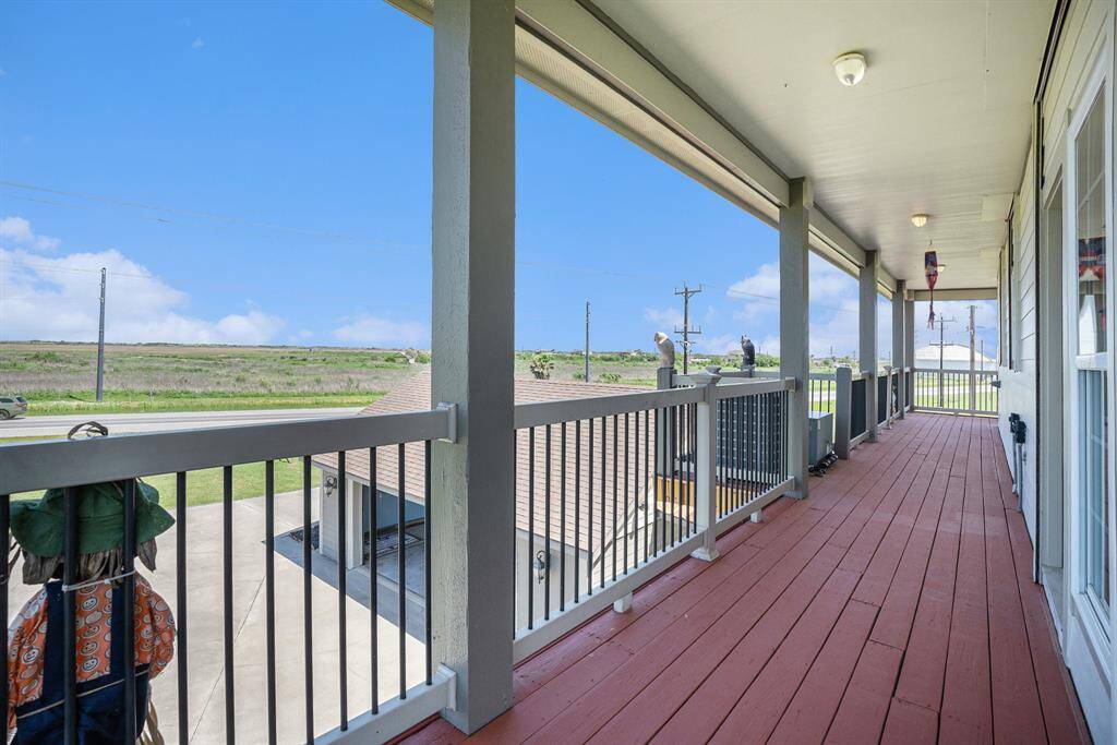 Away from both the beach and the porch, a section of the walk-around deck provides an alternative outdoor space.