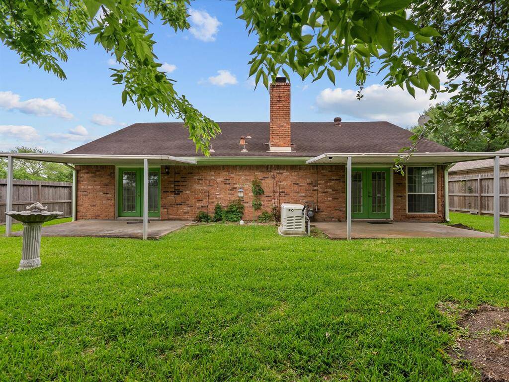 Backyard features mature yard,dual patios,