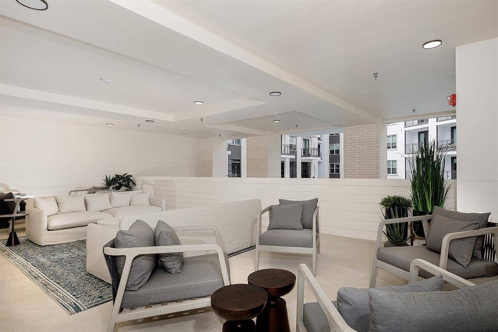 OUTDOOR AREA WITH BALCONY OVERLOOKING POOL