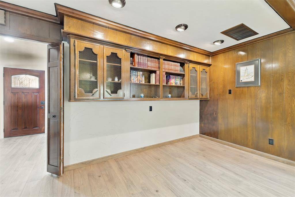 There is a sitting area and built-ins in the den.