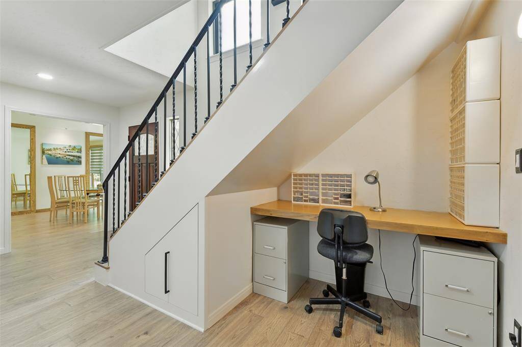 There is a built-in desk tucked underneath the stairs.
