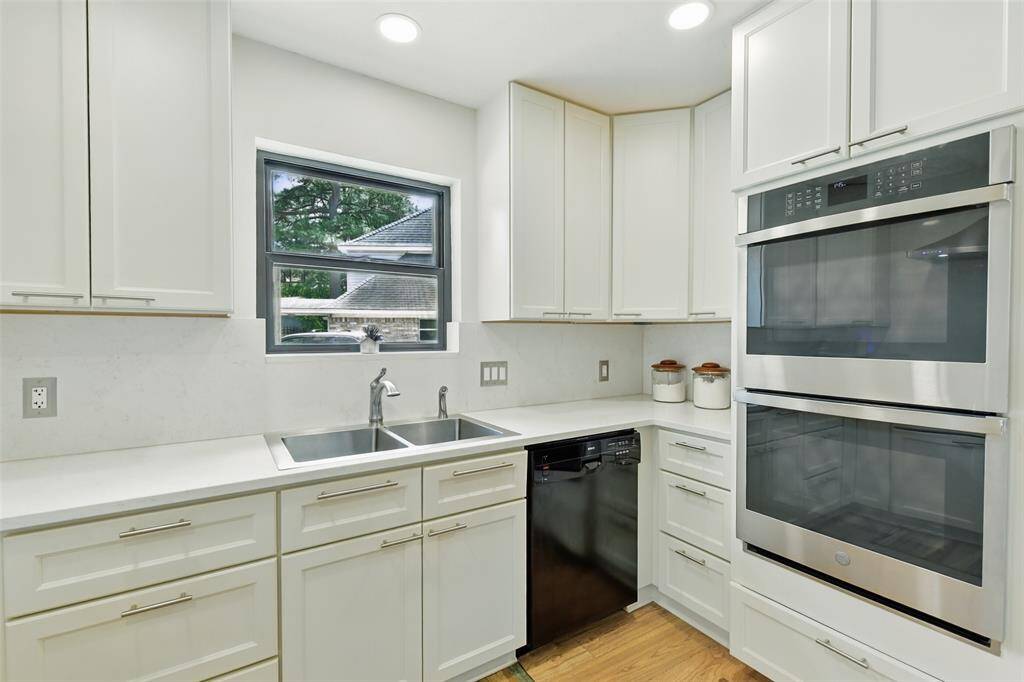 There is also a double basin sink and double oven in the kitchen.