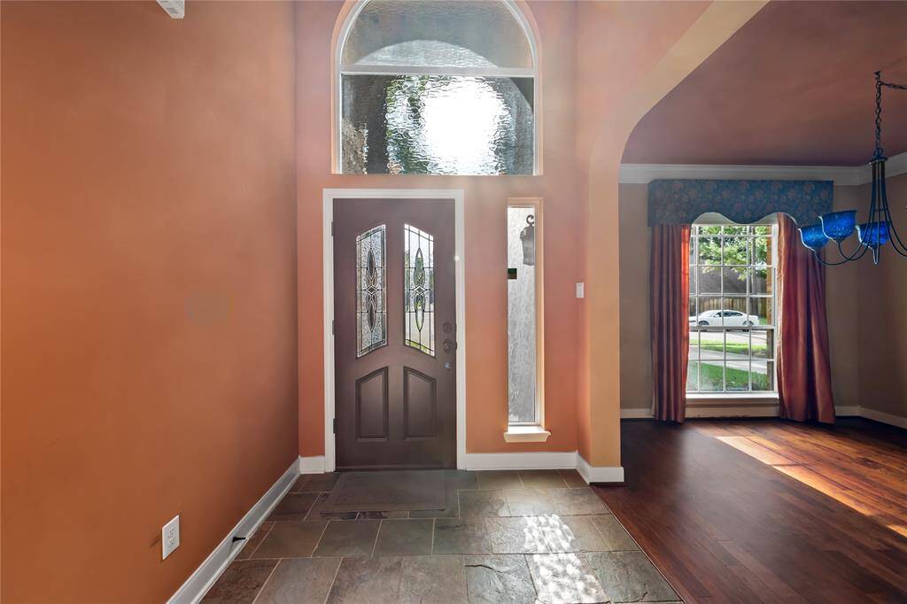 Entry way and the formal dining boast Wimberley Glass Lighting