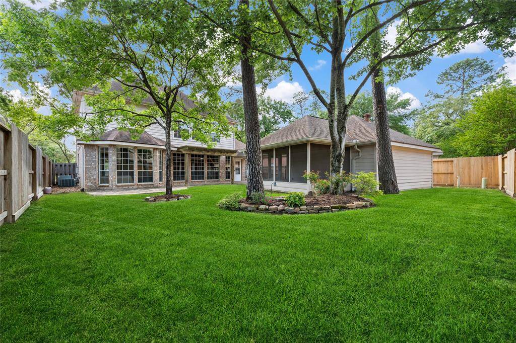 Plenty of shade and tasteful landscape lighting both front and back