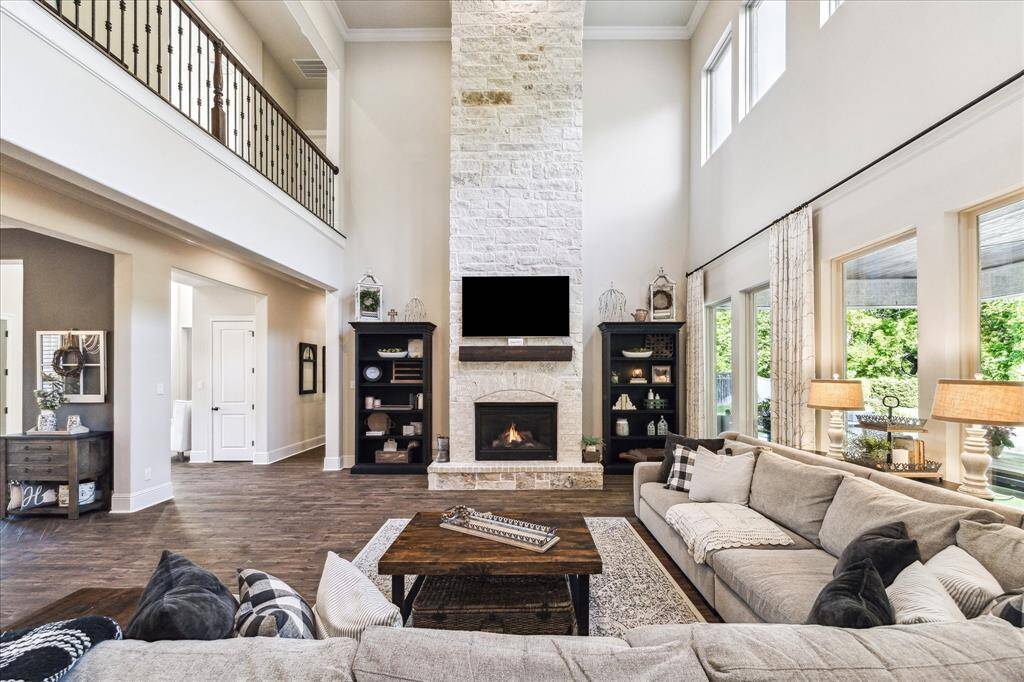 Crafted from Blue Chopped Stone and Silverado King Brick, the striking floor-to-ceiling gas-log fireplace sets the stage for romantic evenings. Its timeless design anchors the room with warmth, charm, and enduring style.