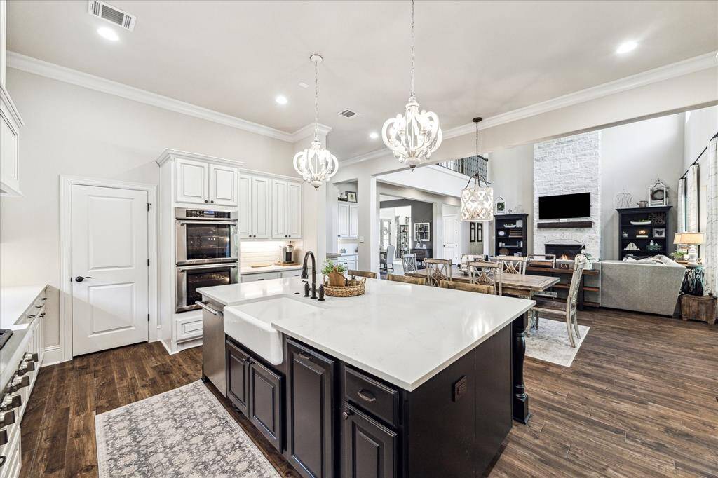 At the heart of this stunning kitchen, the oversized contrasting island makes a bold statement with its deep basin farmhouse sink, sleek Quartz surface, and ample space for meal prep and serving. Designed for both function and style, it also offers convenient bar seating, making it the perfect gathering spot for family and guests alike.