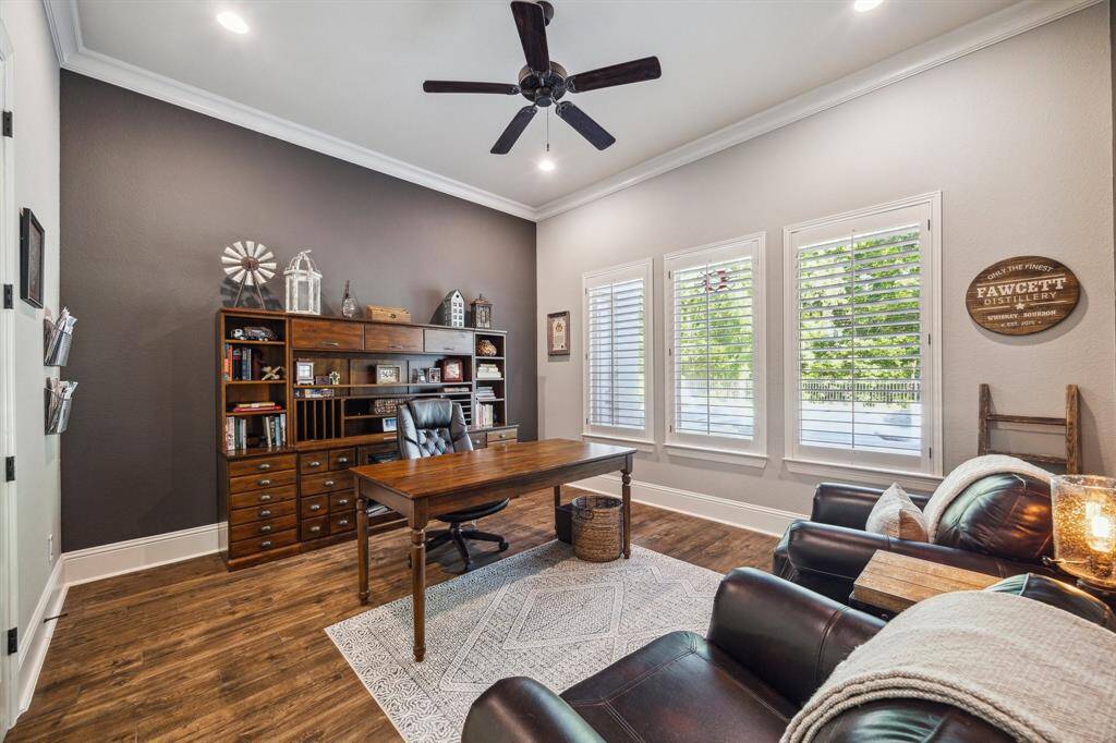 You’re going to love the morning commute to this private home office, tucked behind French doors and perfectly positioned for quiet focus. The space features wood-look tile flooring, wood-shuttered windows, designer paint, a raised ceiling, recessed lighting, a cooling fan for year-round comfort, plus majestic views into your tranquil backyard oasis.