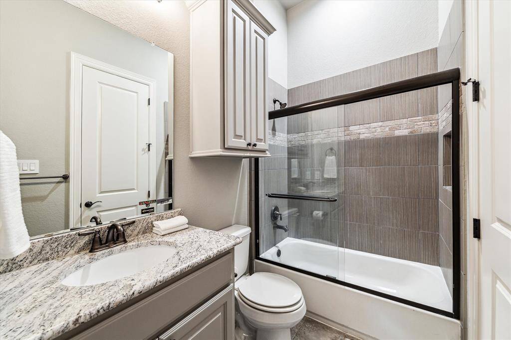 Morning routines should be hassle free with two full bathrooms upstairs. This spotless bathroom offers a single sink granite vanity, extra storage, and a convenient fully tiled tub/shower enclosure.