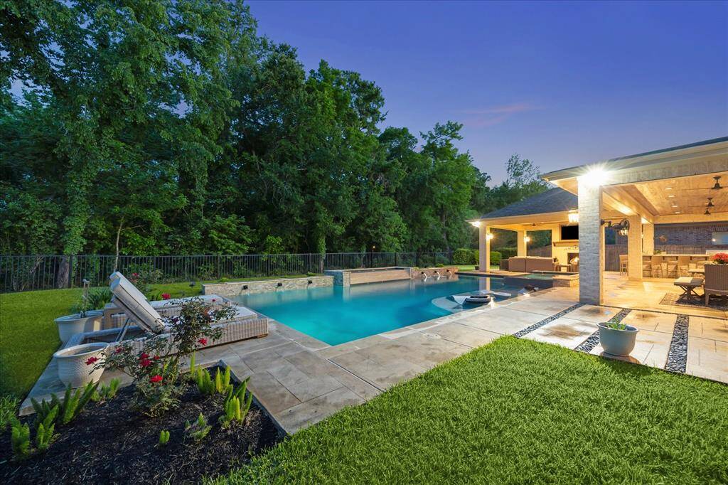 This backyard was made for making memories from barefoot fun on the spacious grassy lawn to poolside play with family and friends. A full sprinkler system makes maintenance a breeze, so you can spend less time on yard work and more time enjoying every moment.