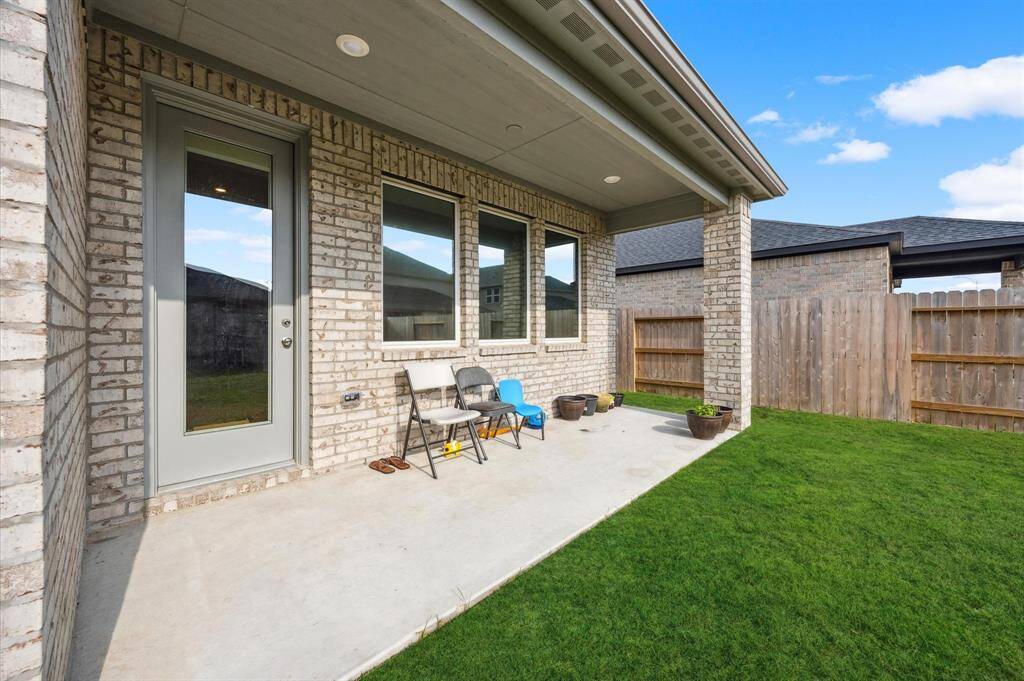 Covered back patio measuring approximately 18x6.