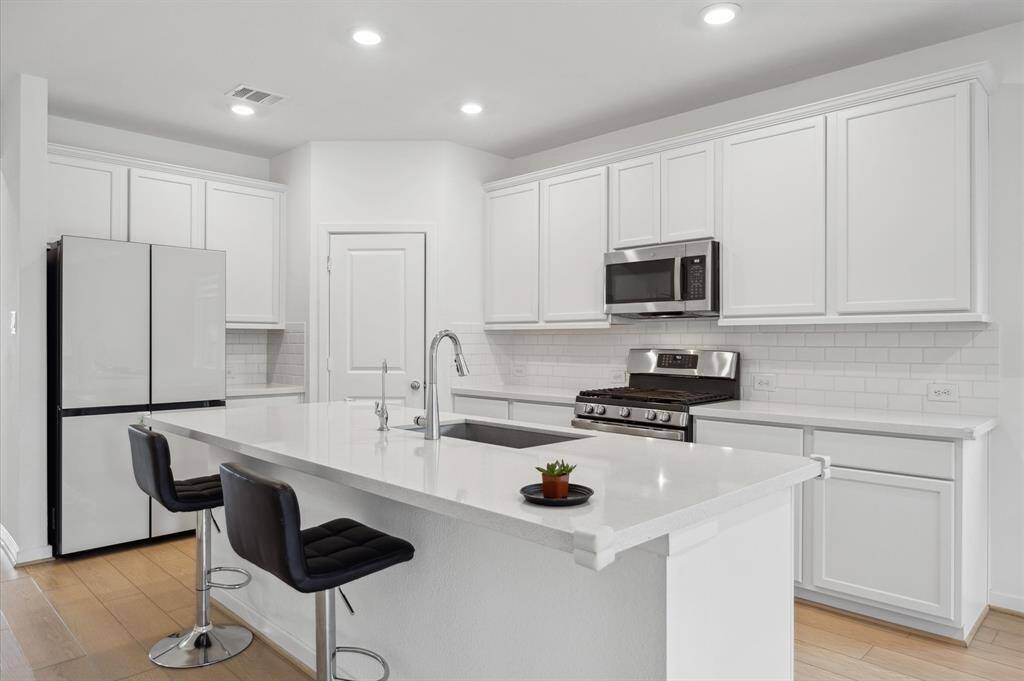 The counter depth Samsung refrigerator stays with the house.