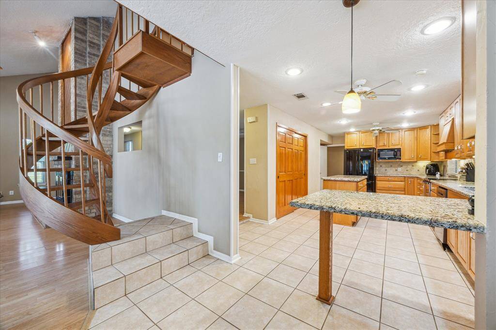 Charming breakfast area with easy access to upstairs den, bedroom, bathroom, and cedar closet.