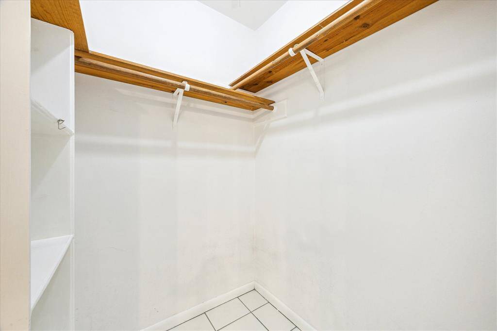Two walk-in closets in the primary suite, offering ample storage and convenience.