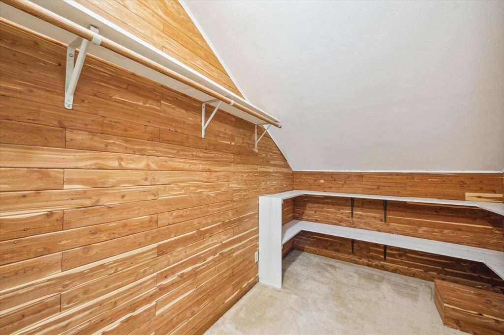 Expansive cedar closet upstairs with convenient attic access.