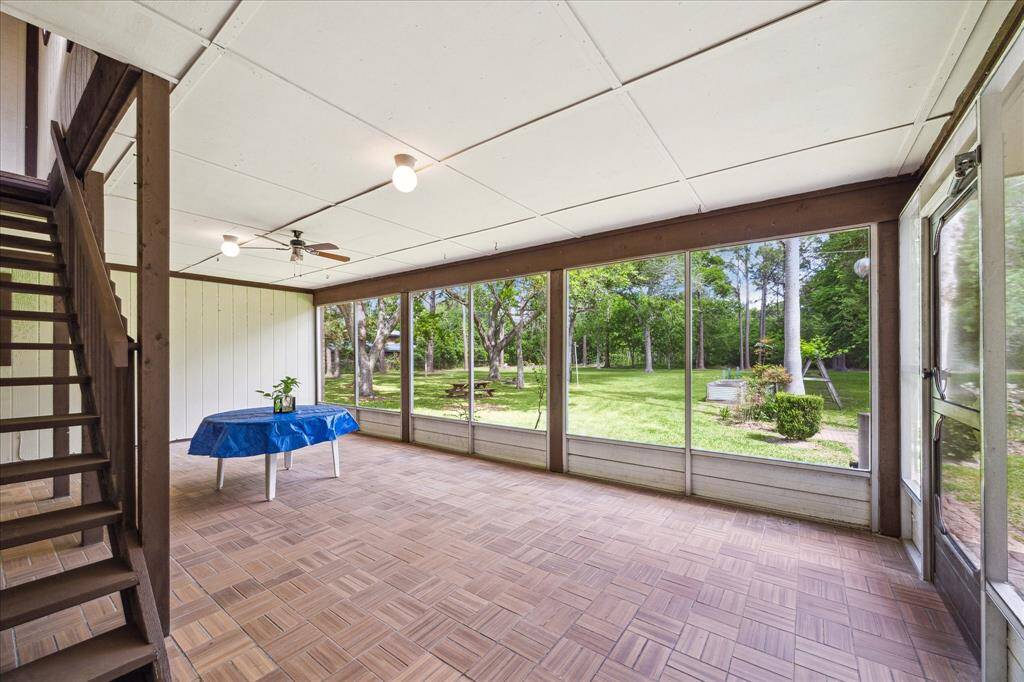 Start your day with coffee on the screened porch, overlooking the serene backyard.