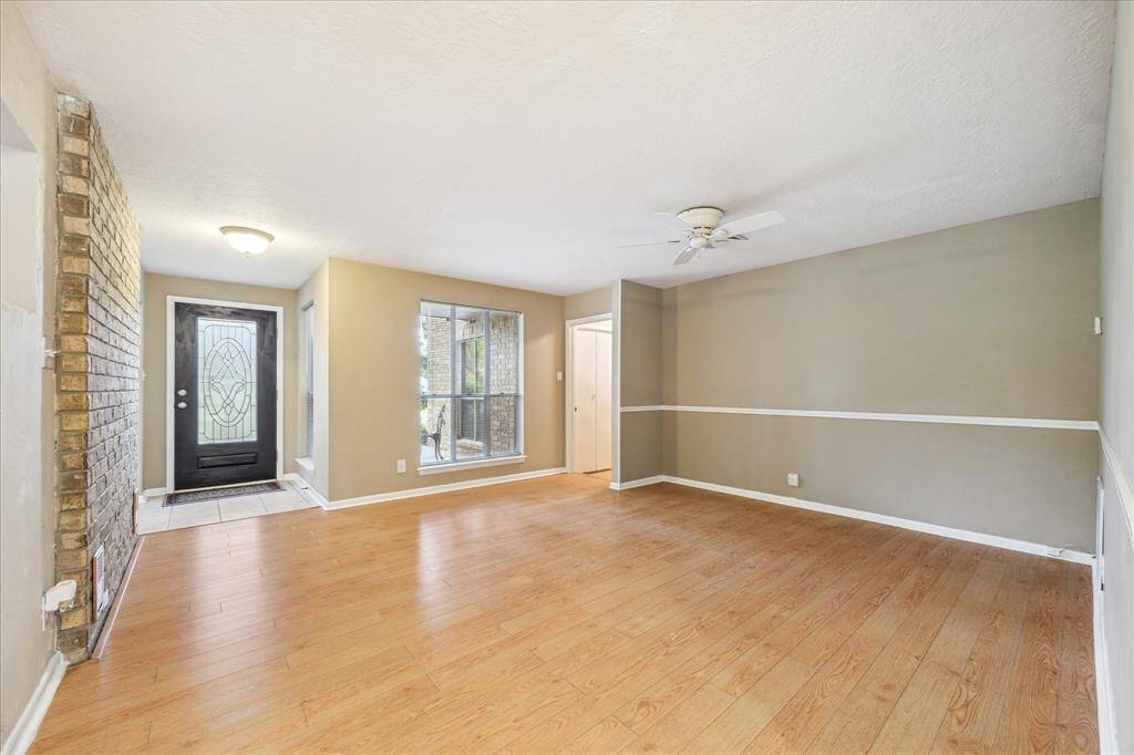 Spacious dining room seamlessly connected to the kitchen, perfect for entertaining.
