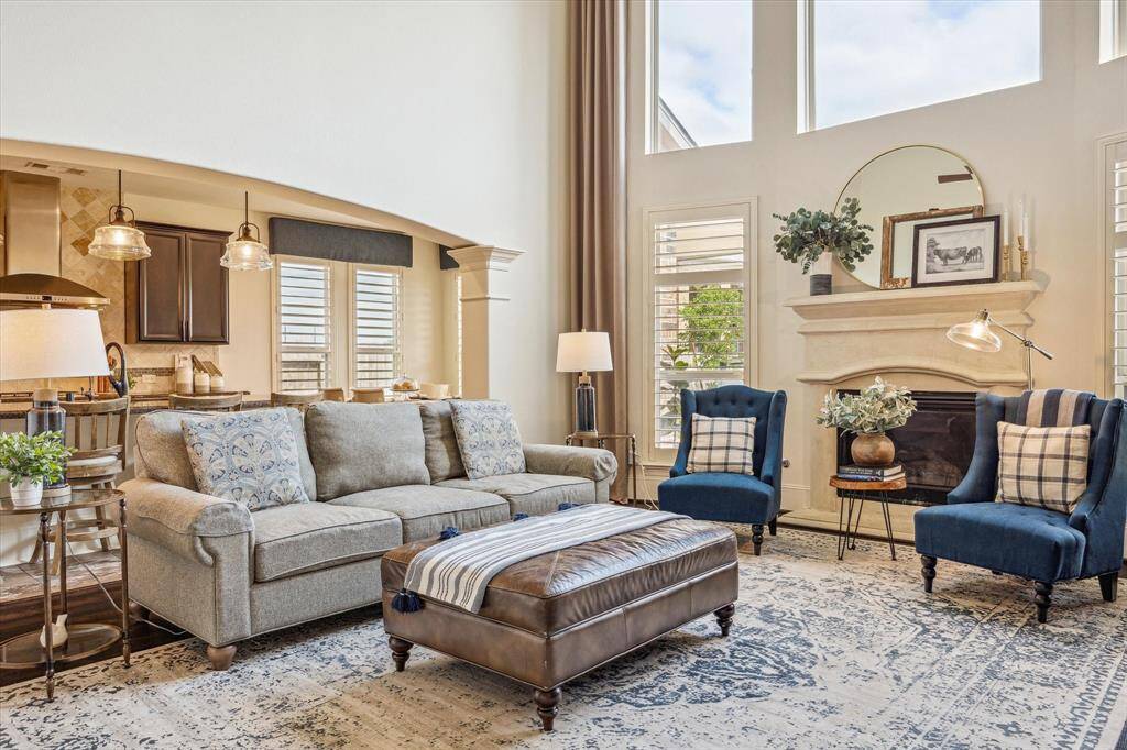 This beautiful family room opens seamlessly to the kitchen and casual dining area, creating a warm and connected space ideal for both everyday living and entertaining with ease.