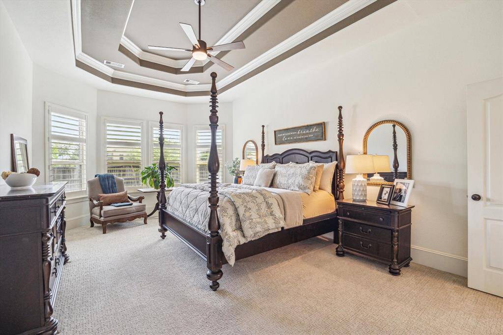 You will have sweet dreams in this posh owner's retreat. It offers soft neutral carpet and paint, a custom tray ceiling, bay windows with wood shutters, a huge walk-in closet and a beautiful ensuite bathroom.