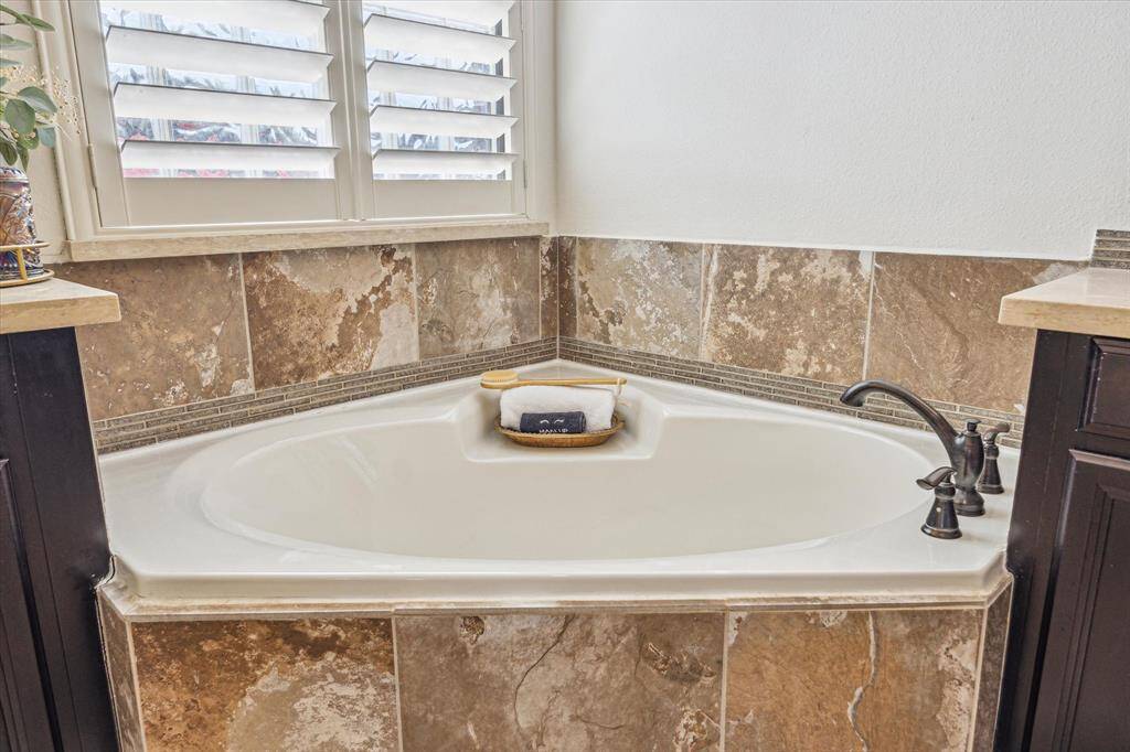 Relax and soak your worries away in this luxurious soaking tub or enjoy a quick rinse in the spacious walk-in shower. Either way, you'll love this private retreat.