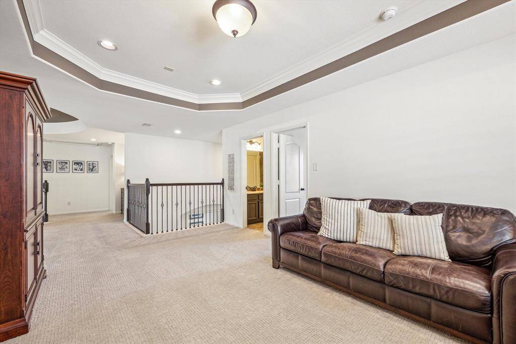 This spacious game room offers plenty of room for your game table, oversized seating, and more creating the perfect setting for fun, relaxation, and quality time with family and friends.