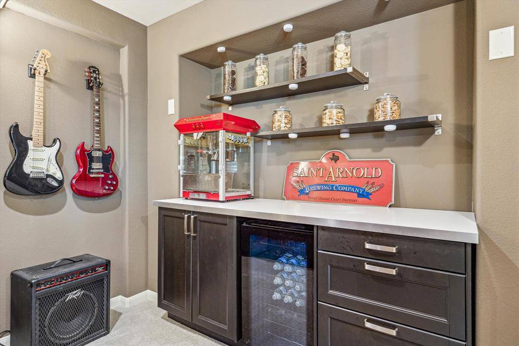 A built-in snack bar setup in the media room adds extra convenience, making it easy to keep your favorite treats and drinks close at hand without missing a moment of the action.