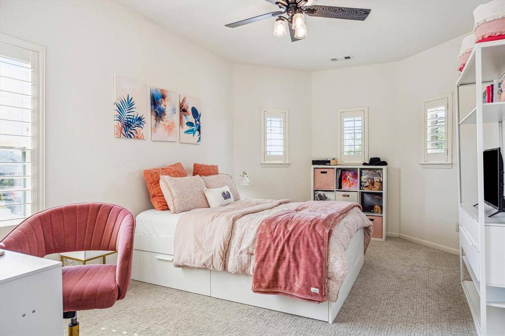 With five very spacious suites, you will always have room for company. This roomy bedroom offers neutral finishes, wood shuttered windows, a cooling fan, large closet and ensuite access to a full bathroom.