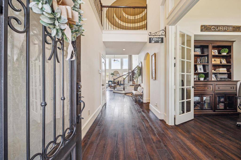 This fabulous home is filled with elegant features from the front door to the back. Enjoy rich hardwood flooring, soaring custom ceilings, chic lighting and fans, and detailed millwork including wood-shuttered windows and graceful arched doorways. At the heart of it all is a grand sweeping staircase crowned by a dramatic rotunda ceiling, making a lasting impression from the moment you step inside.