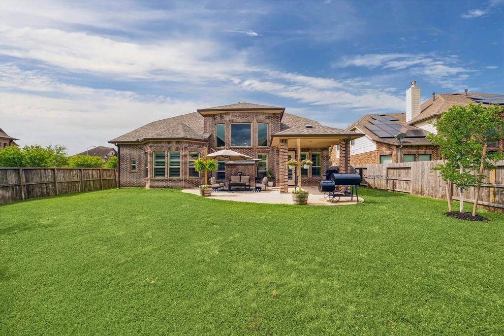 With plenty of space for a swing set, trampoline, and all your favorite outdoor toys, this massive fenced yard is perfect for barefoot fun and endless play. The built-in sprinkler system makes maintenance a breeze, so you can focus on enjoying the great outdoors.