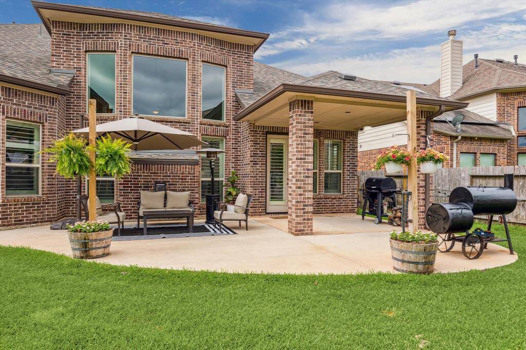 Whether you're hosting lively gatherings or seeking tranquility after a long day, this back yard paradise with a covered patio and sprawling fenced yard with a sprinkler system promises to provide the perfect space where memories are made and stress melts away.