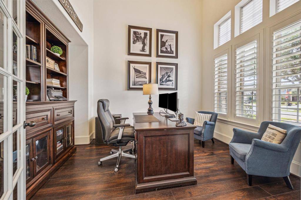 You’re going to love the morning commute to this private study featuring gorgeous hardwood flooring, stacked windows with wood shutters, and plenty of space for all your home office essentials. French doors provide all the privacy needed to make phone calls or attend online meetings or virtual classes.