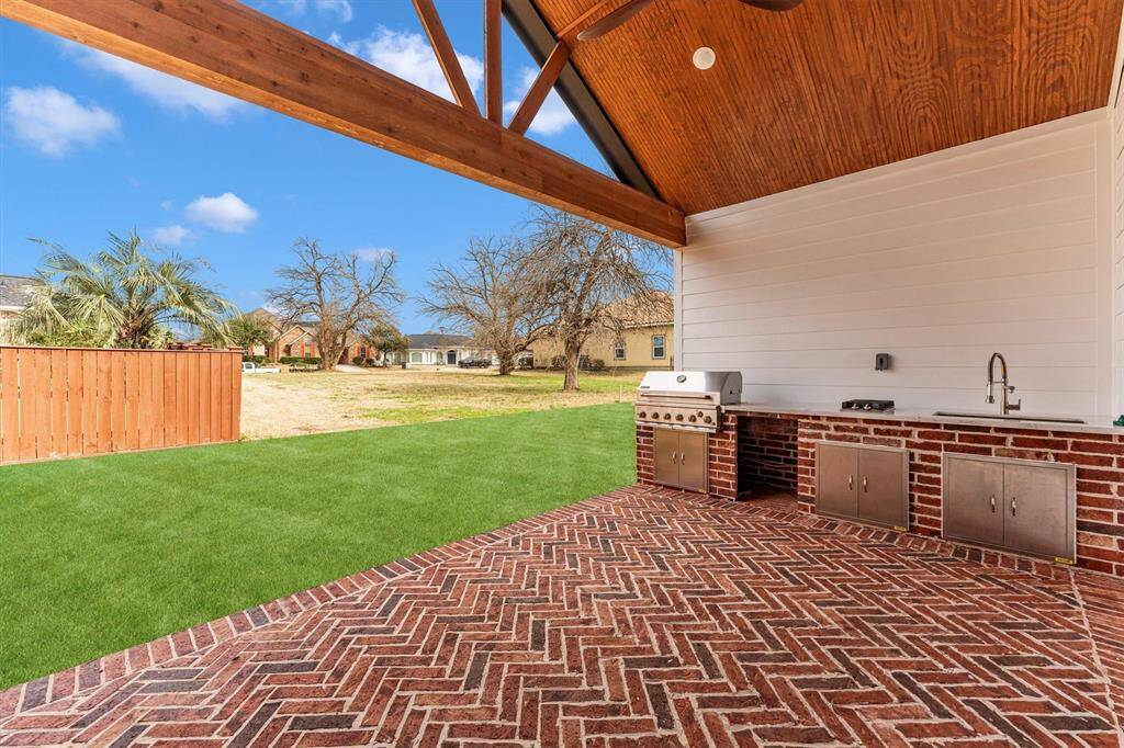 Whether you're hosting a summer barbecue or enjoying a quiet evening meal, this space is perfect for outdoor entertaining