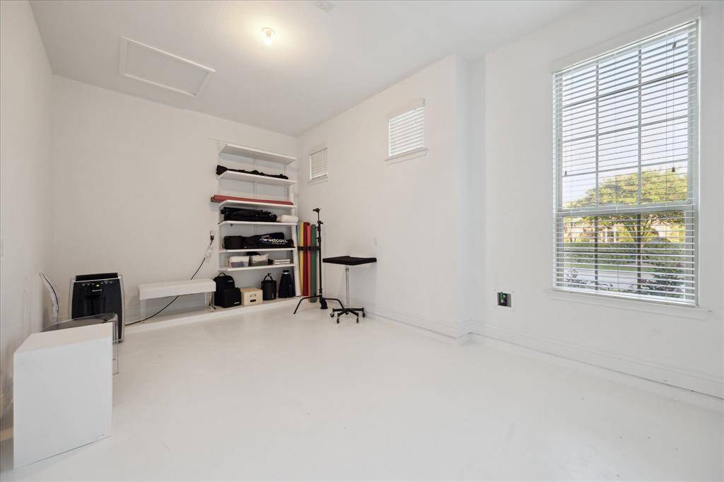View of the Converted, Sound Proofed 3rd Garage Bay. It's the Perfect Room for Photography, a Home Gym or Even a Golf Simulator Room!