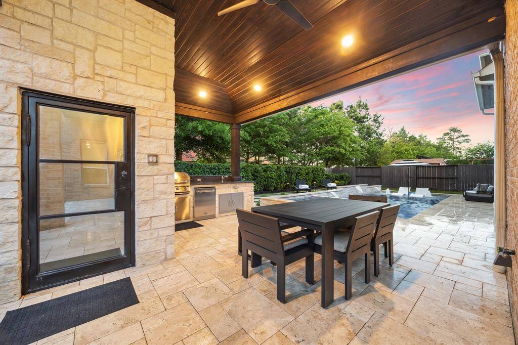 High-end Stone and an Iron Door Invites You in to the Outdoor Bathroom
