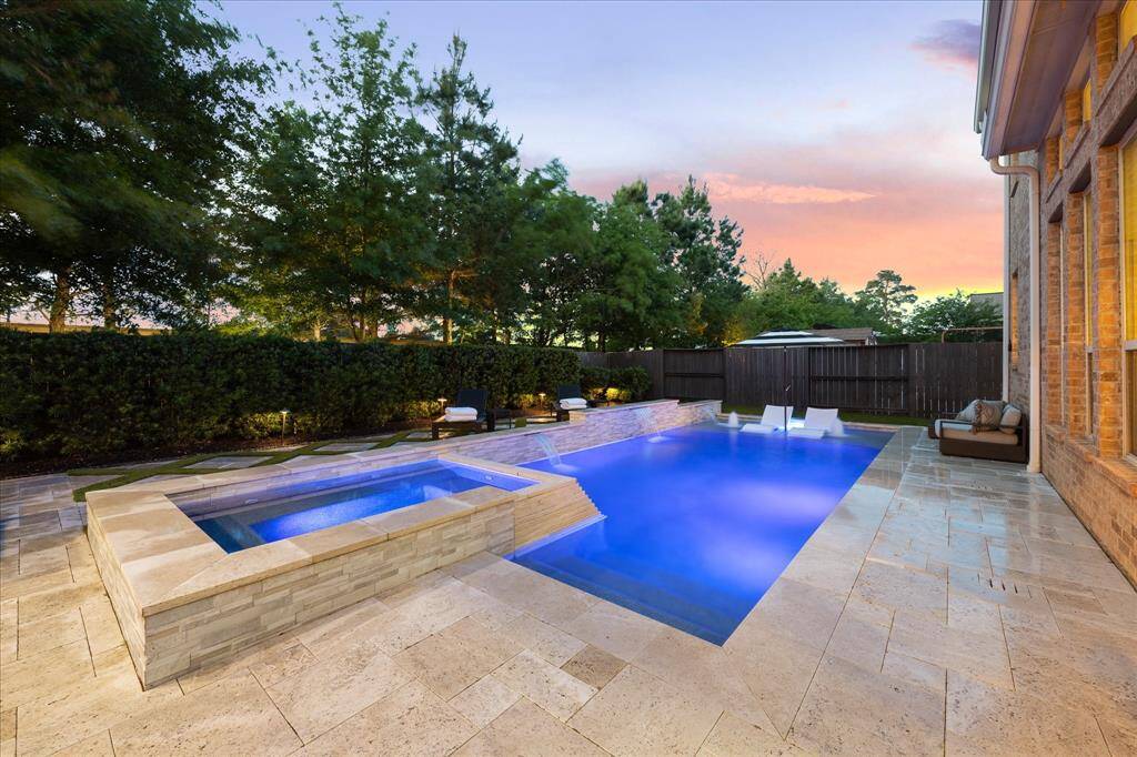 Another View of the Magnificent Backyard! Japanese Yew Line the Back Fence, as well as, Mature Trees Behind the Fence w/ Uplighting!
