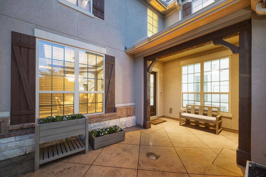 A Tiled Terrace Leads You to the Covered Front Porch Area