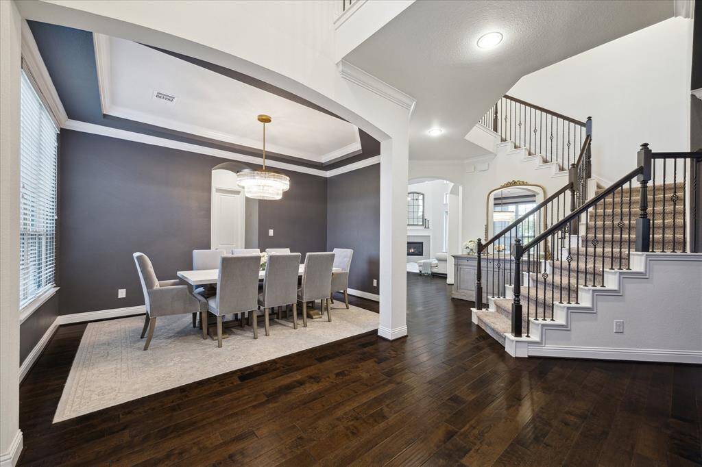 This Home Greets You with a Gorgeous, Spacious Entryway Showcasing Hardwood Floors, High Ceilings and Stunning RH Chandeliers!