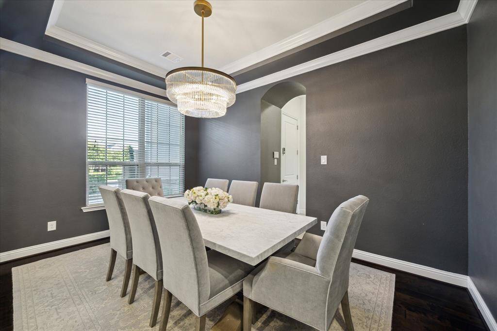 The Formal Dining is Complete with a Tray Ceiling, RH Chandelier and Crown Molding