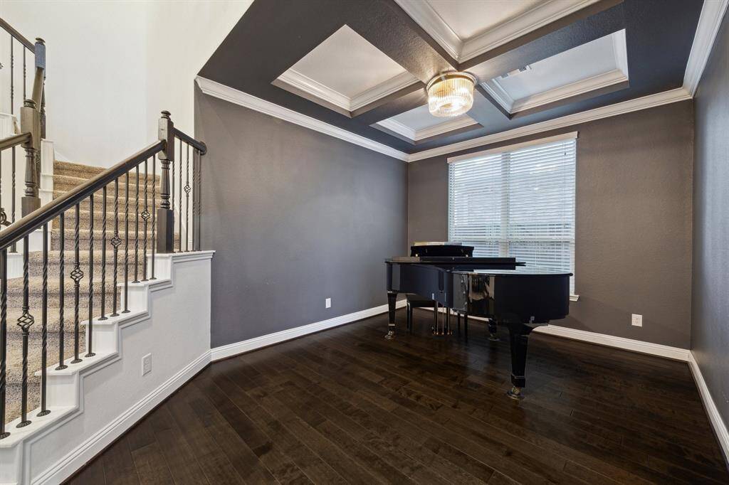 The Moody Formal Living Room w/ Coffered Ceiling and RH Lighting is a Lovely Space for a Piano or Wine / Bourbon Room